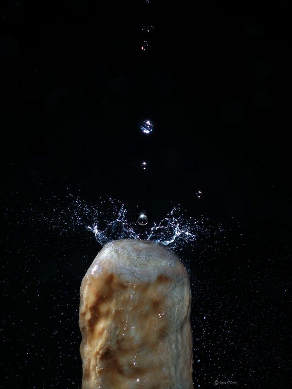 Cave drip splash on a stalagmite, photographed by Garry K. Smith
